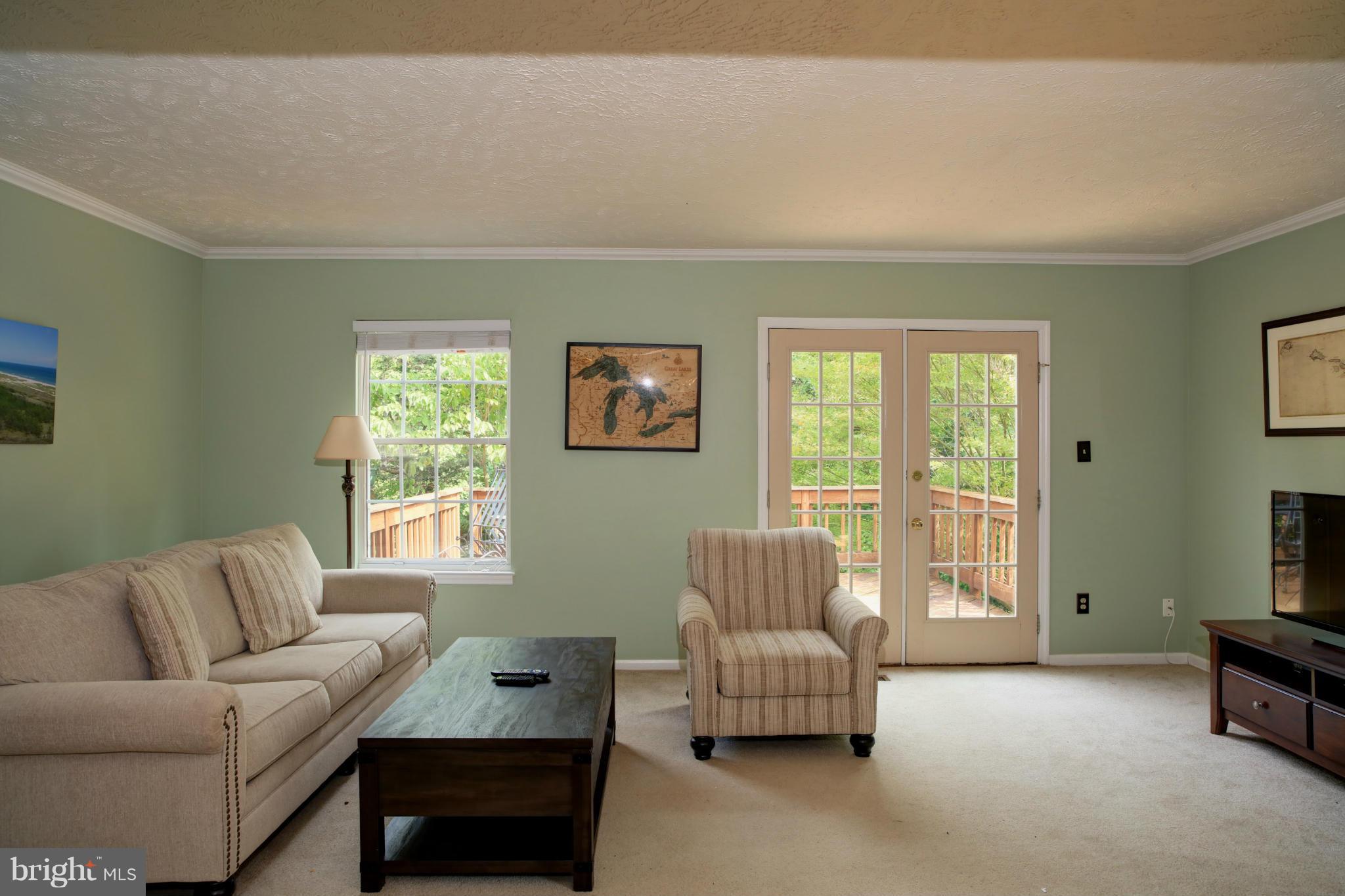 1595 Autumn Ridge Circle Reston, VA 20194 - Photo 8 of 26 a living room with furniture and a window