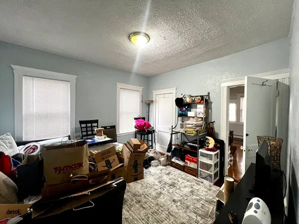a room with gym equipment and a window
