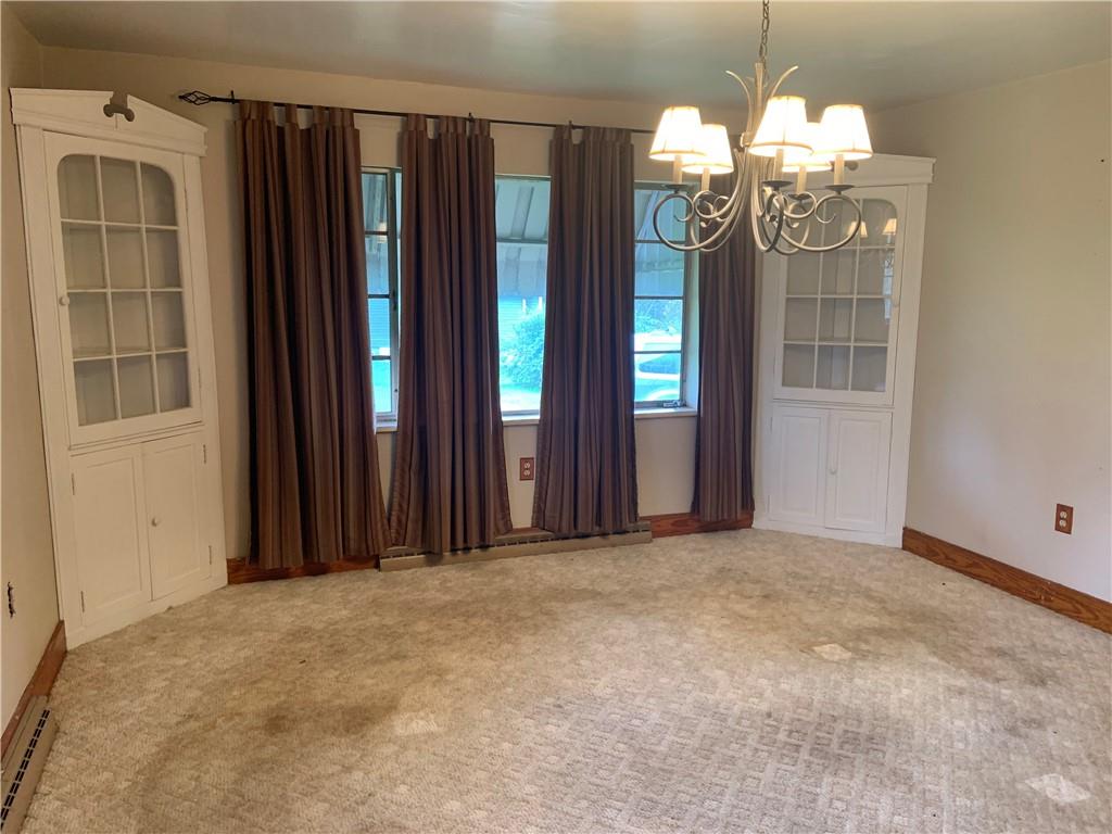 383 Chicora Road Butler, PA 16001 - Photo 5 of 24 an empty room with windows and wooden floor