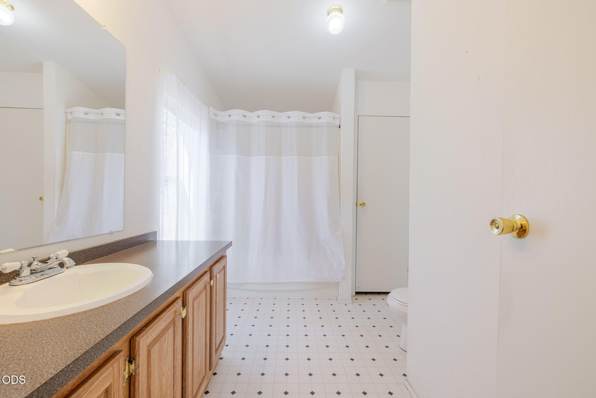 8628 Southwest Crater Loop Road Terrebonne, OR 97760 - Photo 21 of 36 a bathroom with a sink a mirror a shower and a window