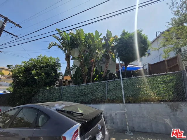 a view of street with parked cars