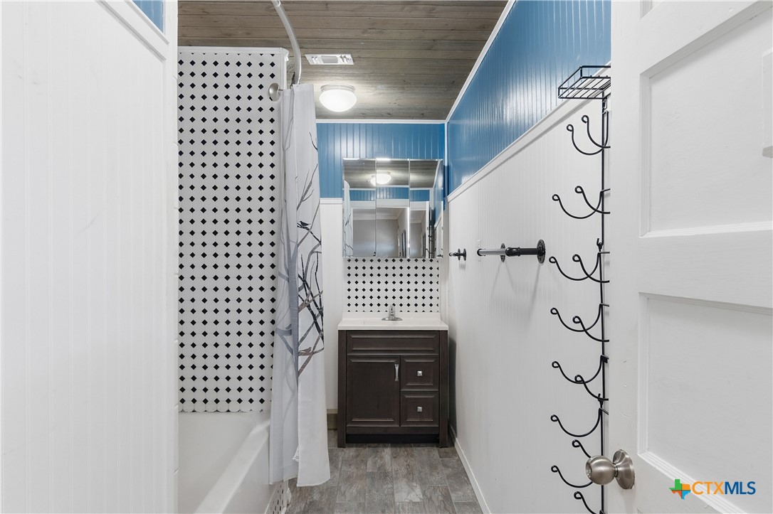 332 West Klein Street Seguin, TX 78155 - Photo 14 of 24 a bathroom with a shower and a sink