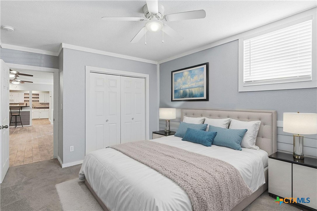 332 West Klein Street Seguin, TX 78155 - Photo 18 of 24 a bedroom with a bed and a lamp