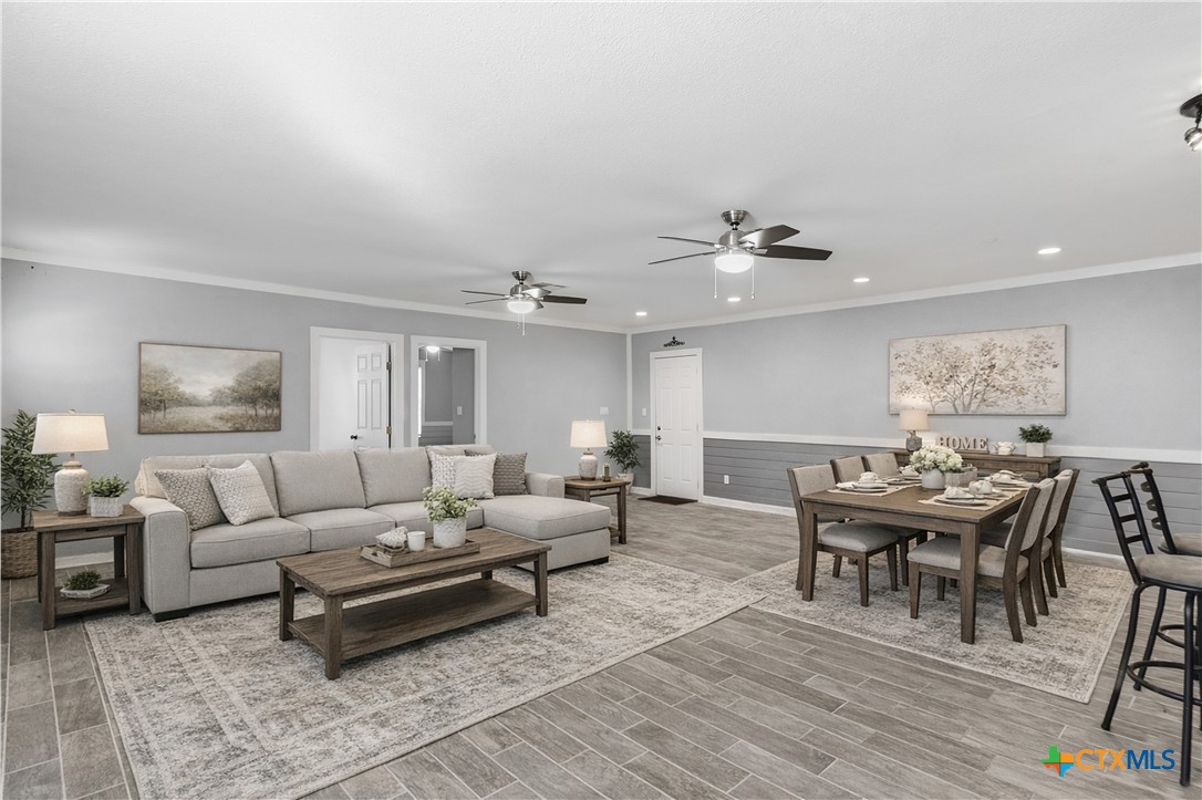 332 West Klein Street Seguin, TX 78155 - Photo 2 of 24 a living room with furniture and wooden floor