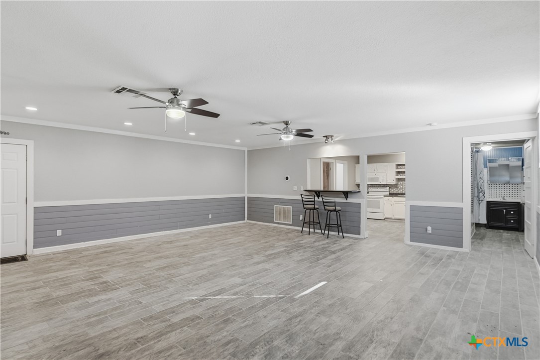 332 West Klein Street Seguin, TX 78155 - Photo 6 of 24 a view of a kitchen with appliances and cabinets