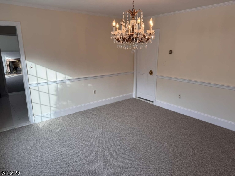 290 Powerville Road Boonton, NJ 07005 - Photo 17 of 20 a view of a chandelier in big room