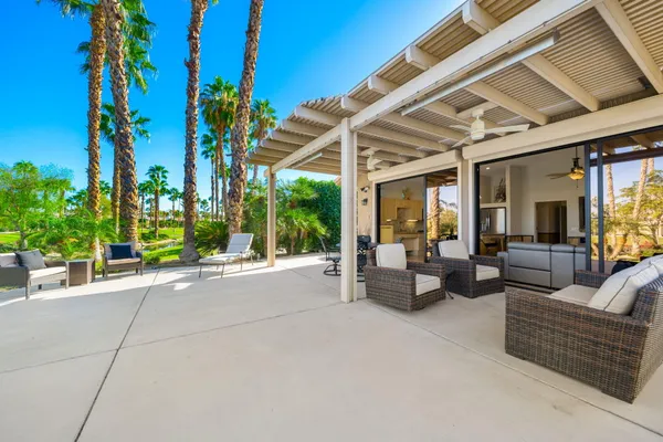 a view of a swimming pool with a lounge chairs
