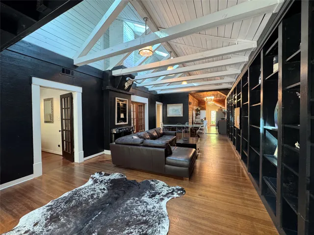 a living room with furniture and stairs