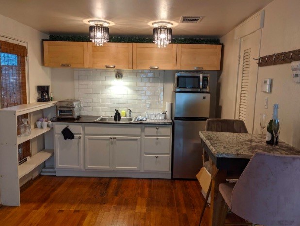4204 Stanford Street Houston, TX 77006 - Photo 15 of 19 a kitchen with cabinets a sink and appliances