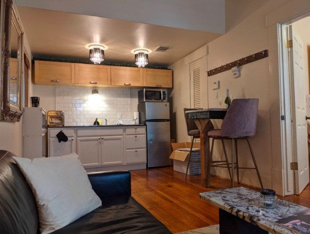 4204 Stanford Street Houston, TX 77006 - Photo 16 of 19 a kitchen with a sink appliances and cabinets