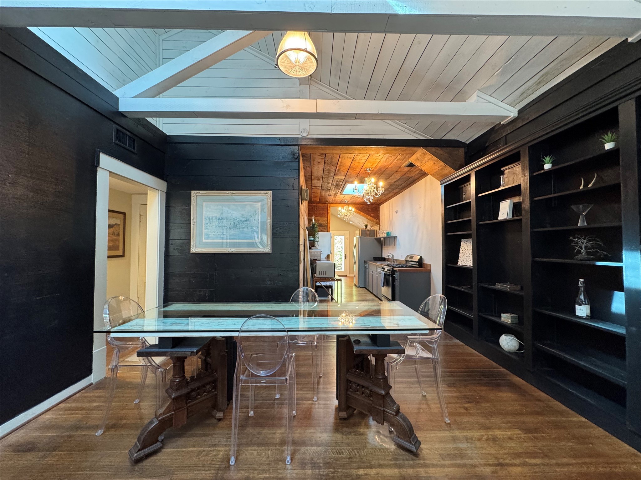 4204 Stanford Street Houston, TX 77006 - Photo 5 of 19 a living room with a table and a flat screen tv