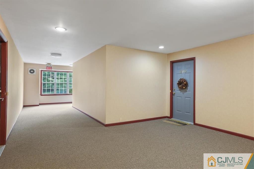 809 Meadow Court, Unit 809 Helmetta, NJ 08828 - Photo 2 of 8 an empty room with windows