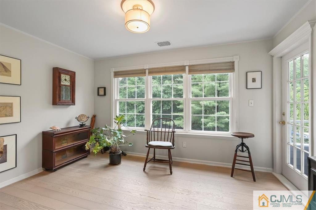 809 Meadow Court, Unit 809 Helmetta, NJ 08828 - Photo 6 of 8 a living room with furniture and a window