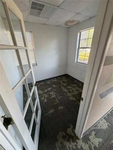 a view of an empty room with a window
