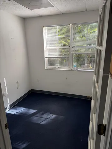 a view of an empty room with a window