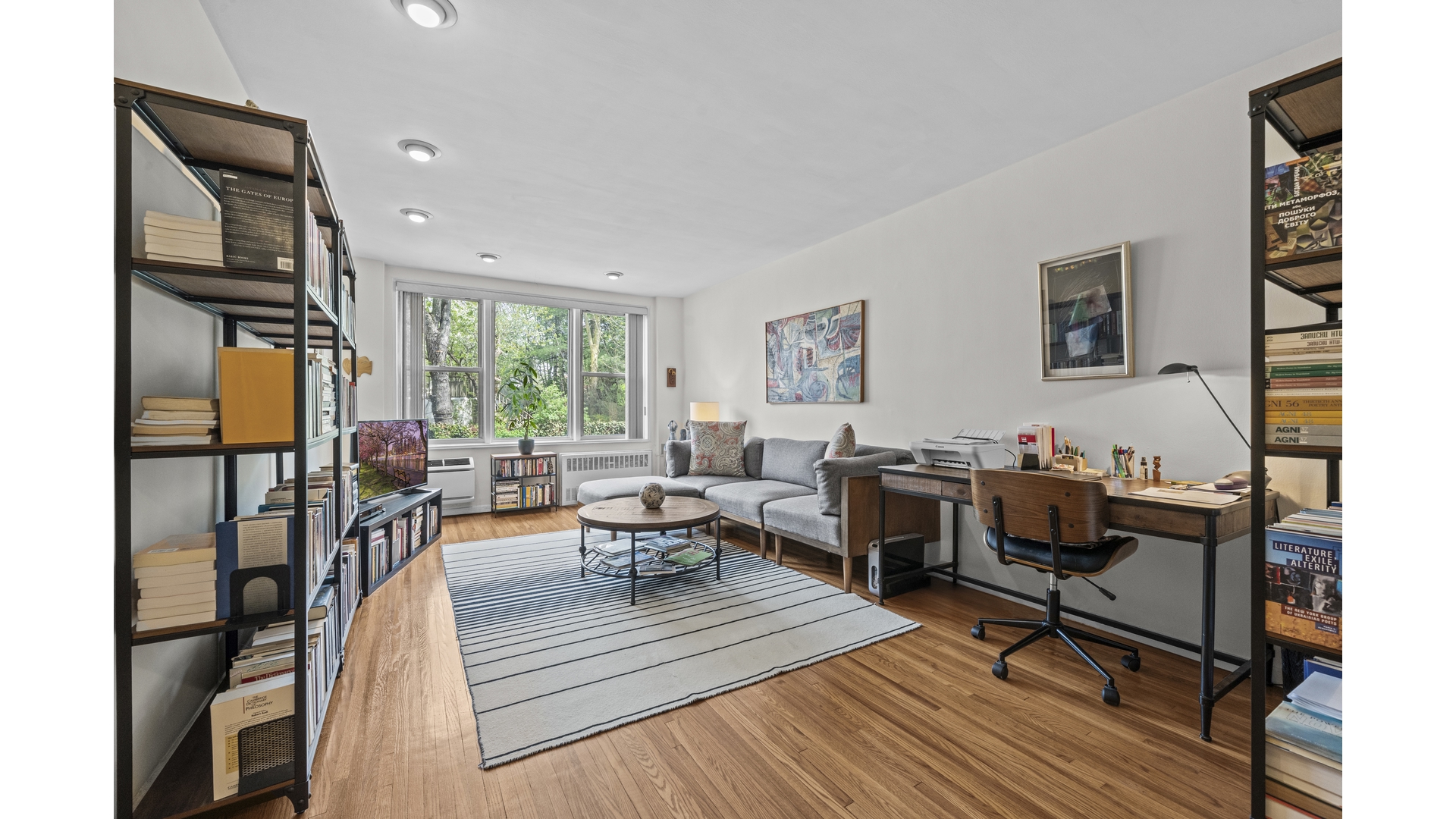 601 Kappock Street, Unit 2F Bronx, NY 10463 - Photo 1 of 15 a living room with furniture a rug and a window