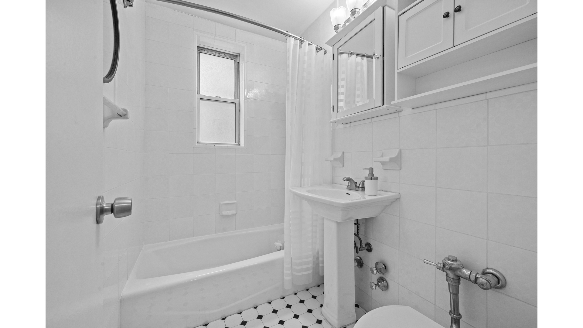 601 Kappock Street, Unit 2F Bronx, NY 10463 - Photo 10 of 15 a bathroom with a sink a toilet and shower
