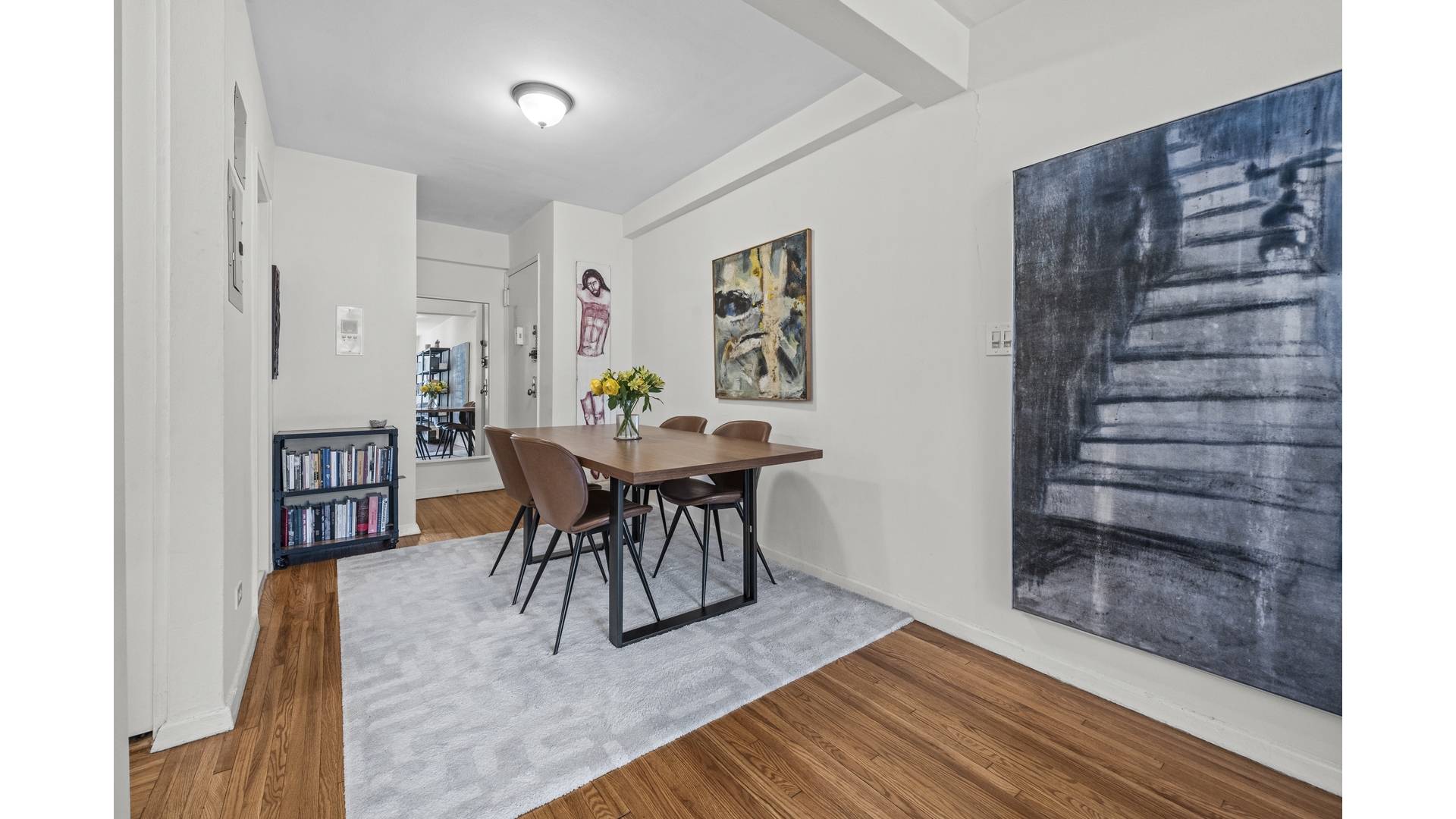 601 Kappock Street, Unit 2F Bronx, NY 10463 - Photo 4 of 15 a dining room with furniture and wooden floor