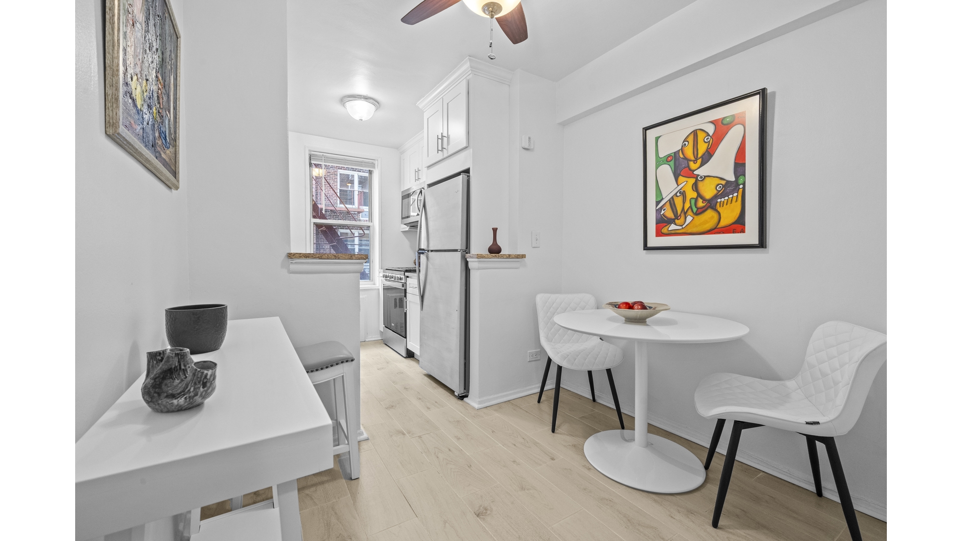 601 Kappock Street, Unit 2F Bronx, NY 10463 - Photo 5 of 15 a view of a workspace with furniture and bathroom view