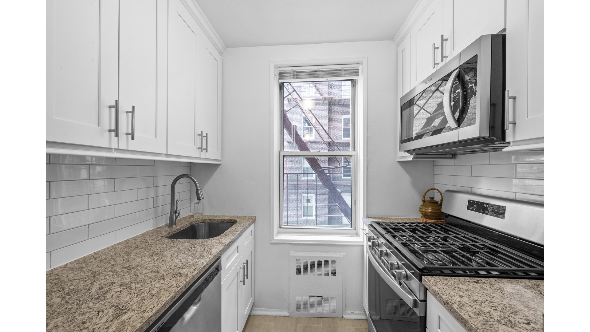 601 Kappock Street, Unit 2F Bronx, NY 10463 - Photo 7 of 15 a kitchen with stainless steel appliances granite countertop a stove and a sink