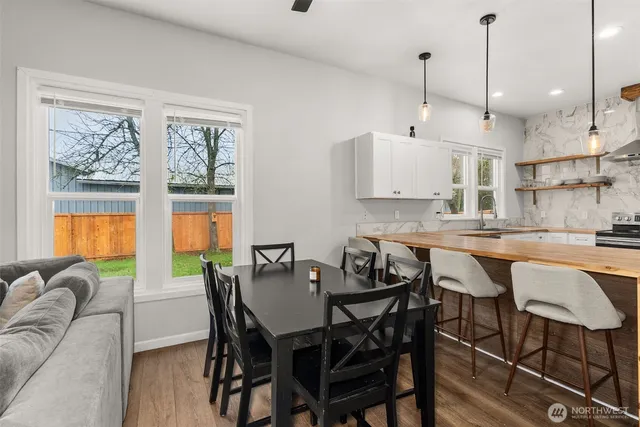 a bedroom with a bed and a mirror