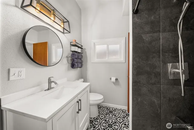 a view of an entryway with wooden floor and windows