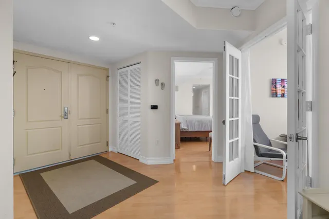 a view of a hallway with bathroom