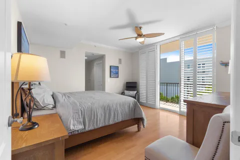 a bedroom with a bed and a chair