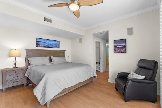 a bedroom with a bed and a chair