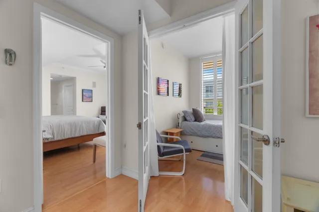 a bedroom with a bed and a desk