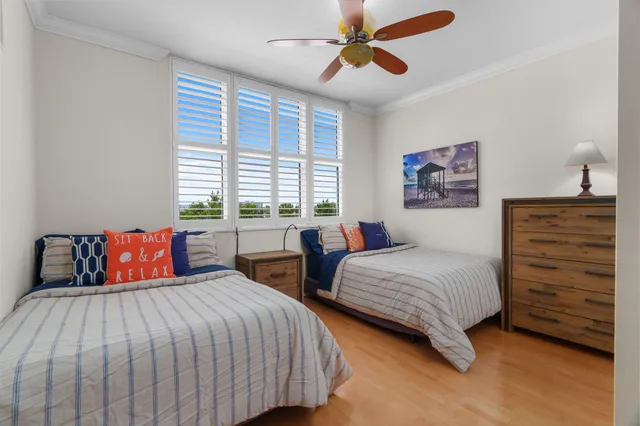a bedroom with a bed and a view of living room
