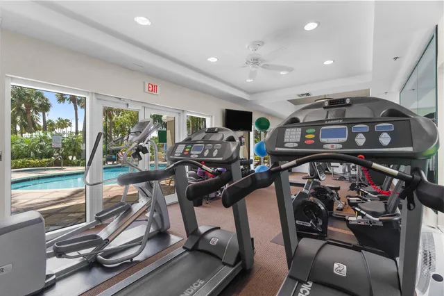 a room with gym equipment and a large window