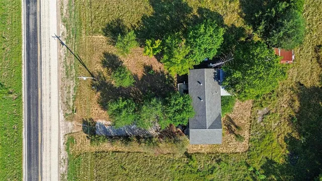 a backyard of a house with yard barbeque oven and outdoor seating