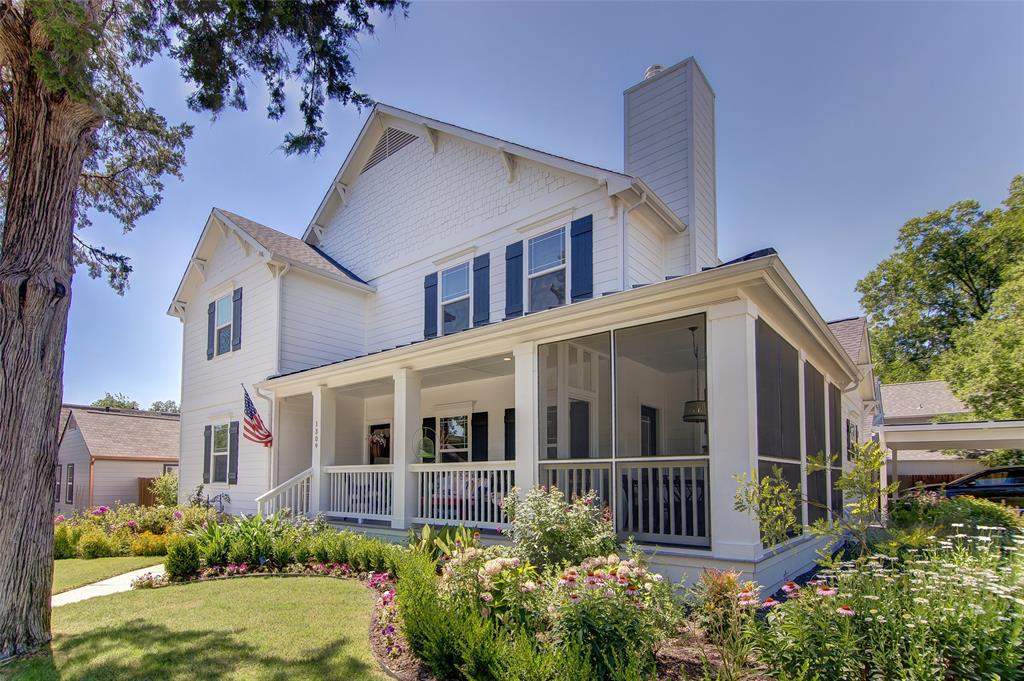 1309 Howell Street McKinney, TX 75069 - Photo 1 of 32 a view of a house with brick walls and flower plants