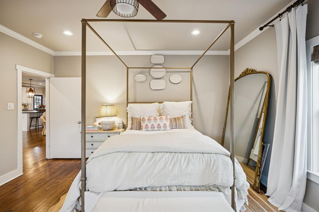 1309 Howell Street McKinney, TX 75069 - Photo 14 of 32 a bedroom with a large bed and wooden floor