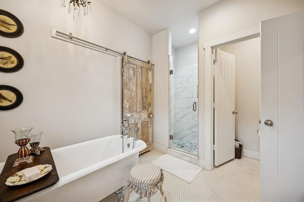 1309 Howell Street McKinney, TX 75069 - Photo 16 of 32 a bathroom with a tub shower sink and toilet