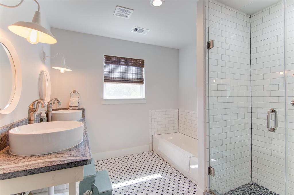 1309 Howell Street McKinney, TX 75069 - Photo 21 of 32 a bathroom with a sink toilet and shower