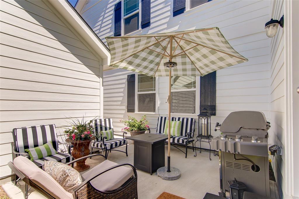 1309 Howell Street McKinney, TX 75069 - Photo 31 of 32 a view of a patio with couple of chairs and a potted plant