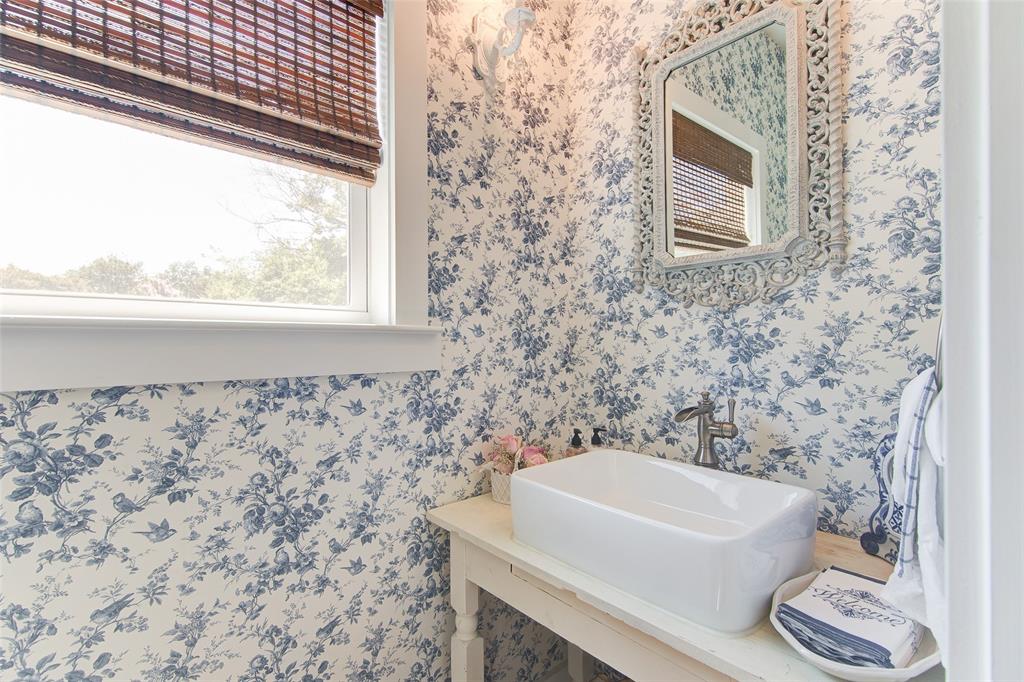 1309 Howell Street McKinney, TX 75069 - Photo 10 of 32 a bathroom with a sink and a bathtub