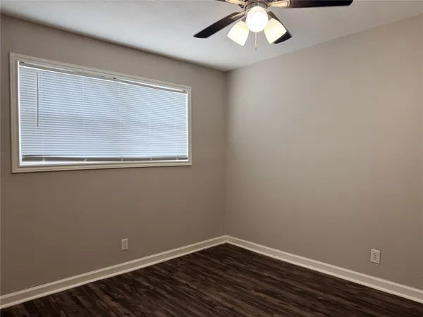 a bathroom with a granite countertop sink toilet and bathtub