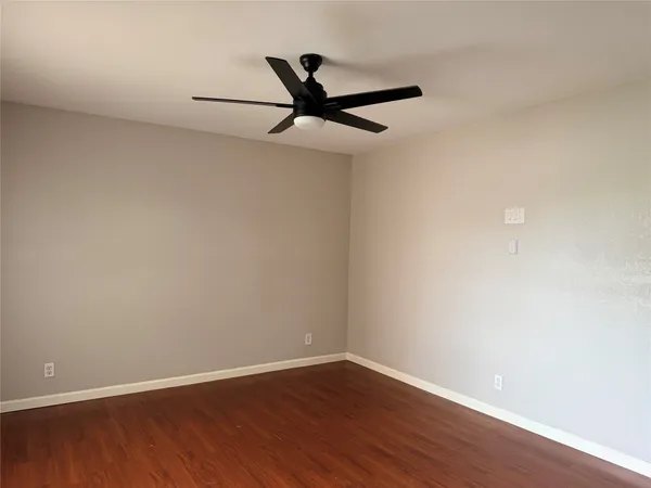 a view of a big room with wooden floor