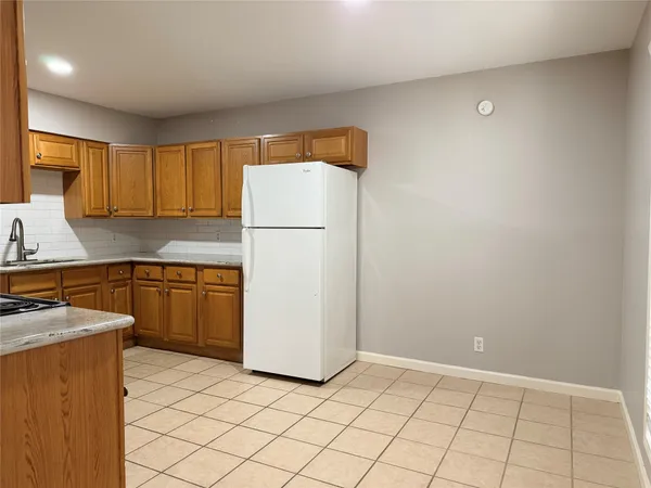 a kitchen with stainless steel appliances a stove sink and microwave