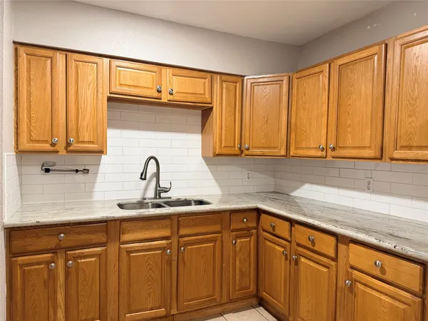 a white refrigerator freezer sitting in a kitchen