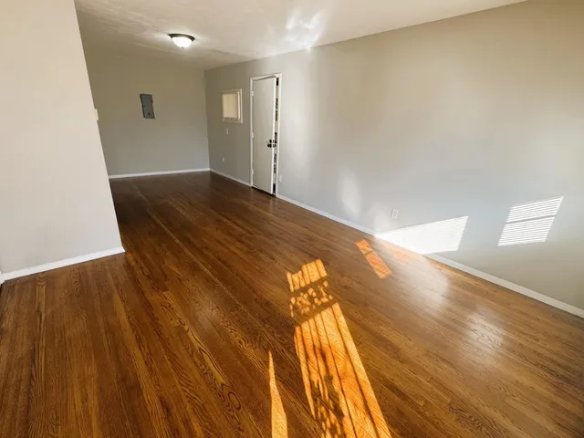 a view of a big room with wooden floor