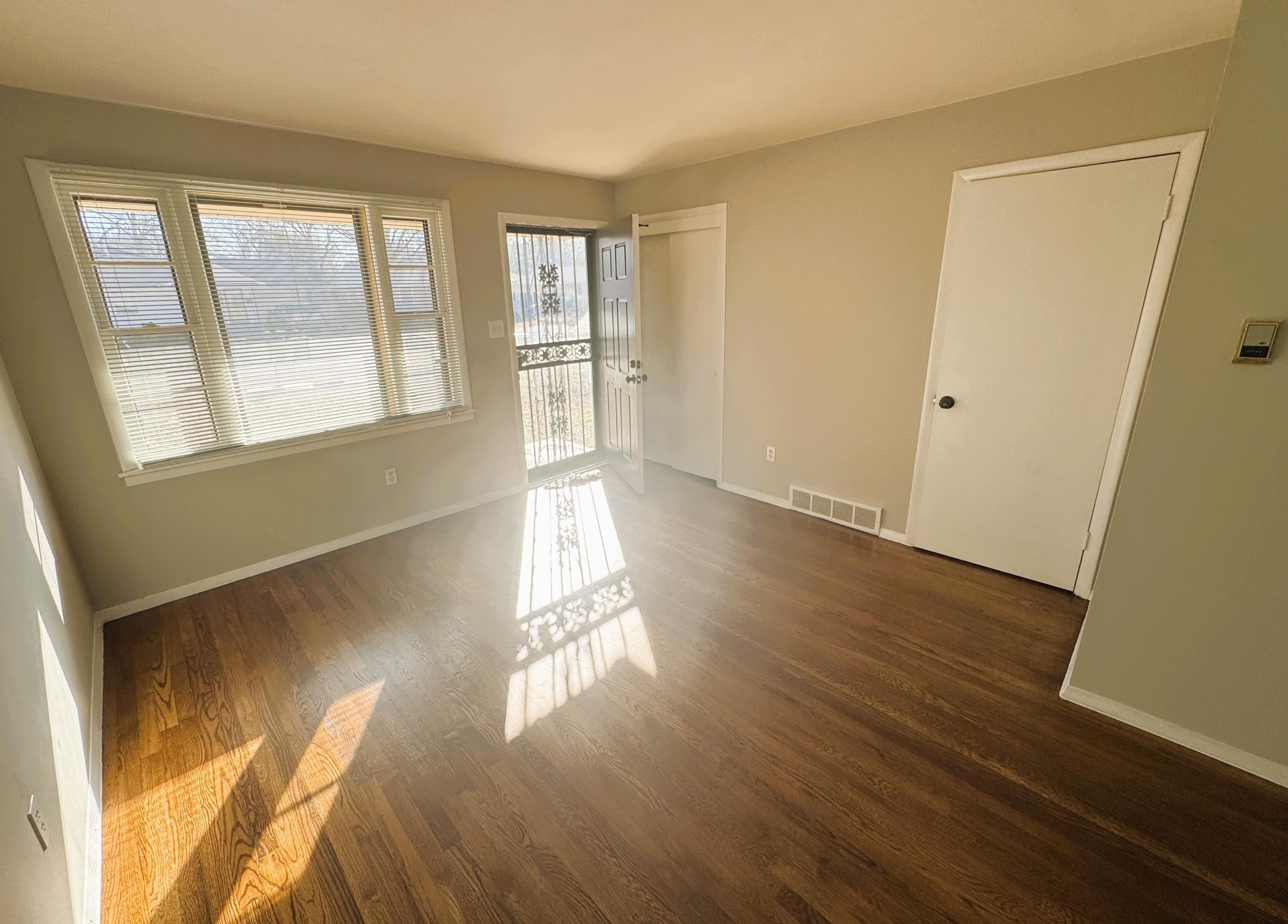 4956 Owen Road Memphis, TN 38122 - Photo 4 of 14 Unfurnished room featuring dark wood-style floors and baseboards