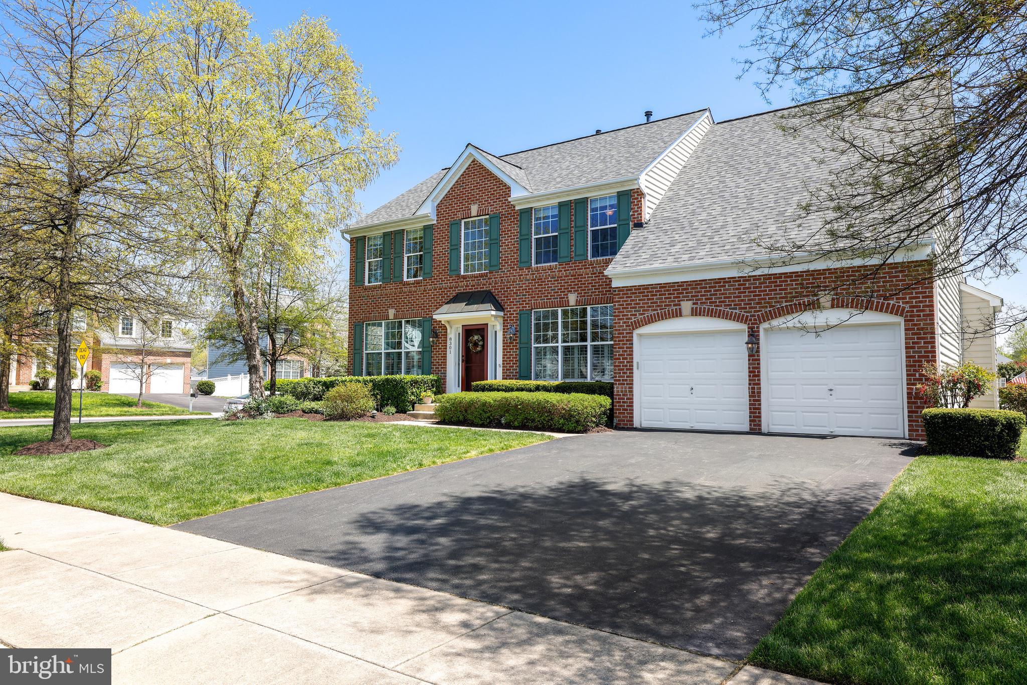 8301 Banister Road Severn, MD 21144 - Photo 12 of 57 a front view of a house with a yard and garage