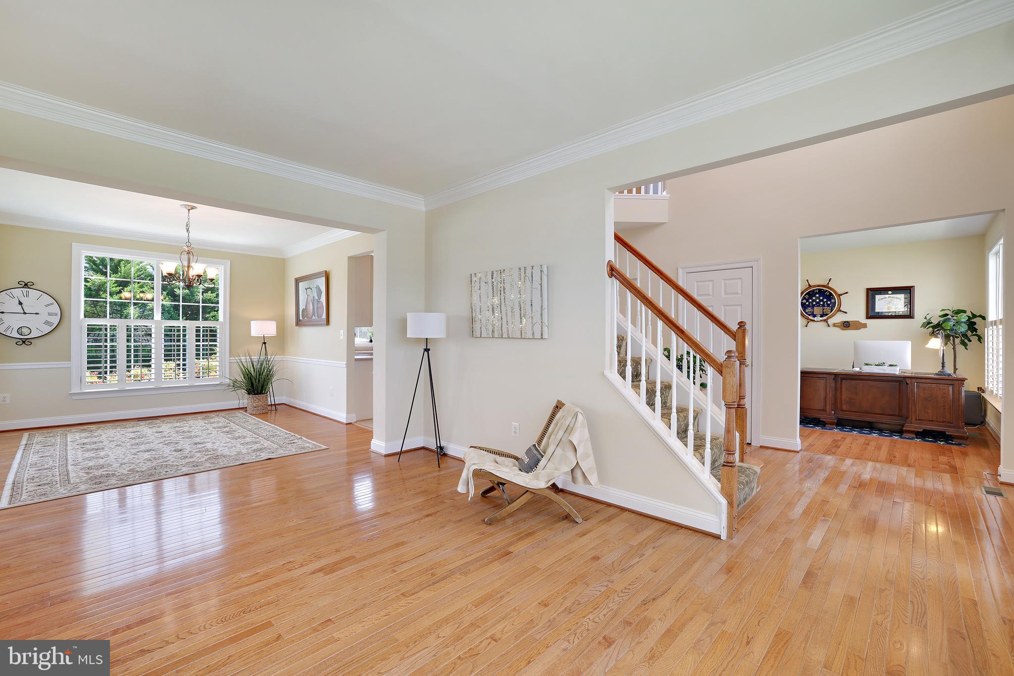 8301 Banister Road Severn, MD 21144 - Photo 16 of 57 a view of a bedroom with wooden floor and stairs