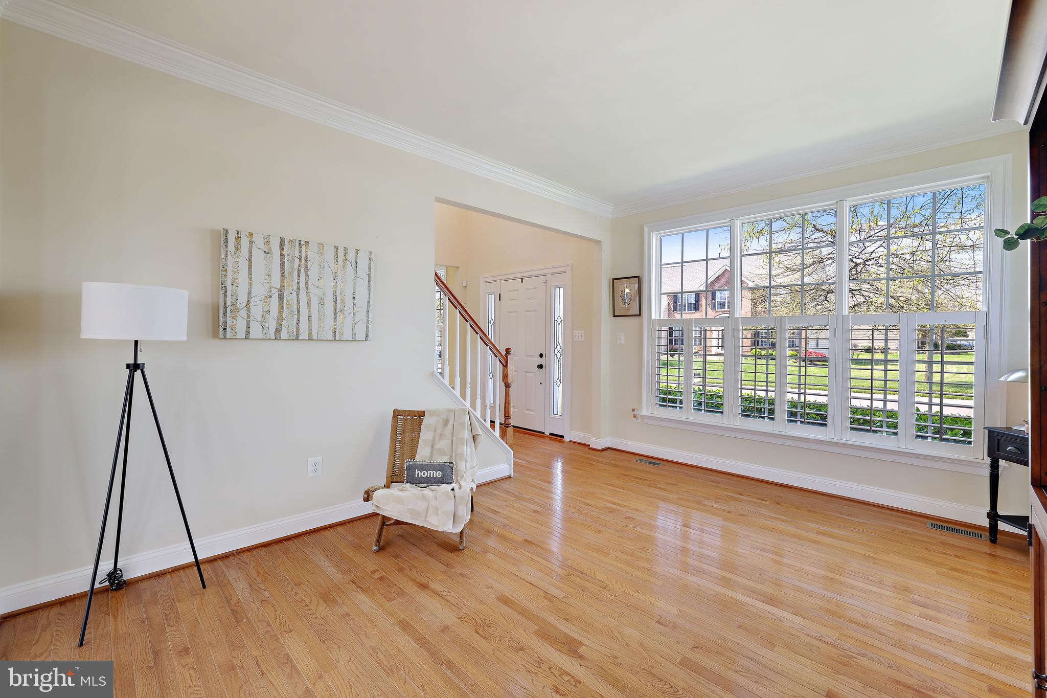 8301 Banister Road Severn, MD 21144 - Photo 17 of 57 a view of room with wooden floor and windows