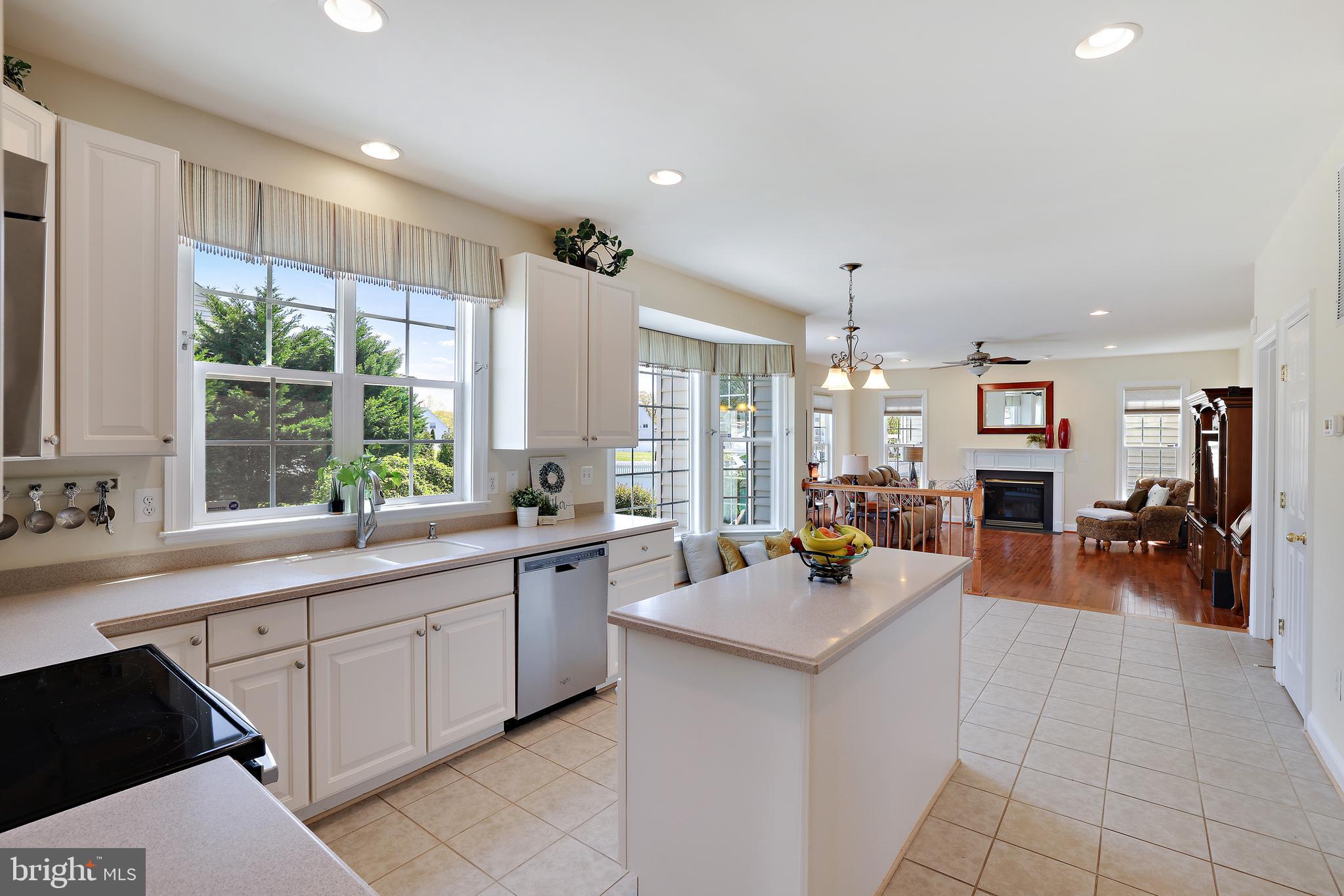 8301 Banister Road Severn, MD 21144 - Photo 19 of 57 a large white kitchen with a large window and counter space