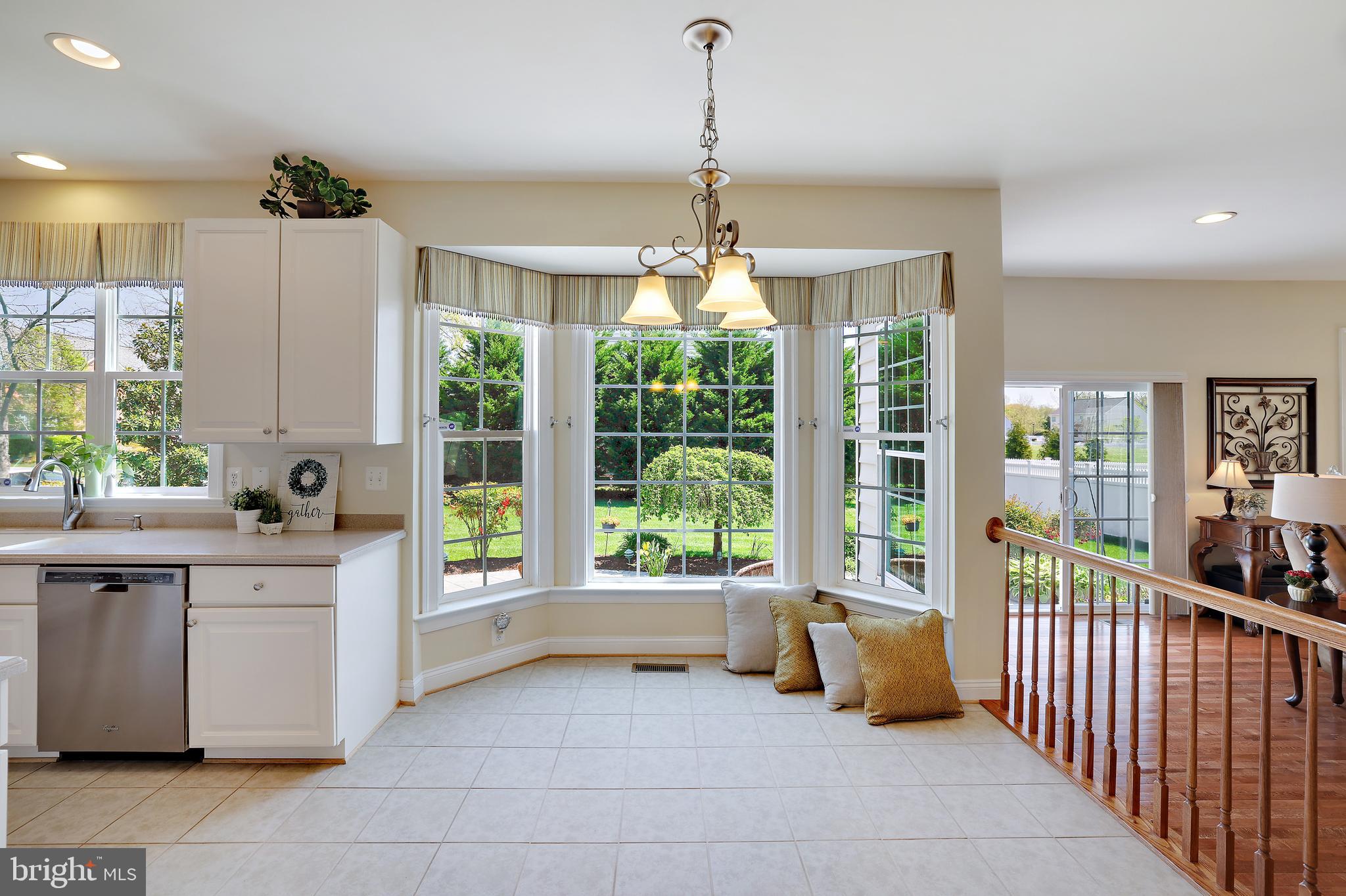 8301 Banister Road Severn, MD 21144 - Photo 22 of 57 a very nice looking living room with a large window and chandelier